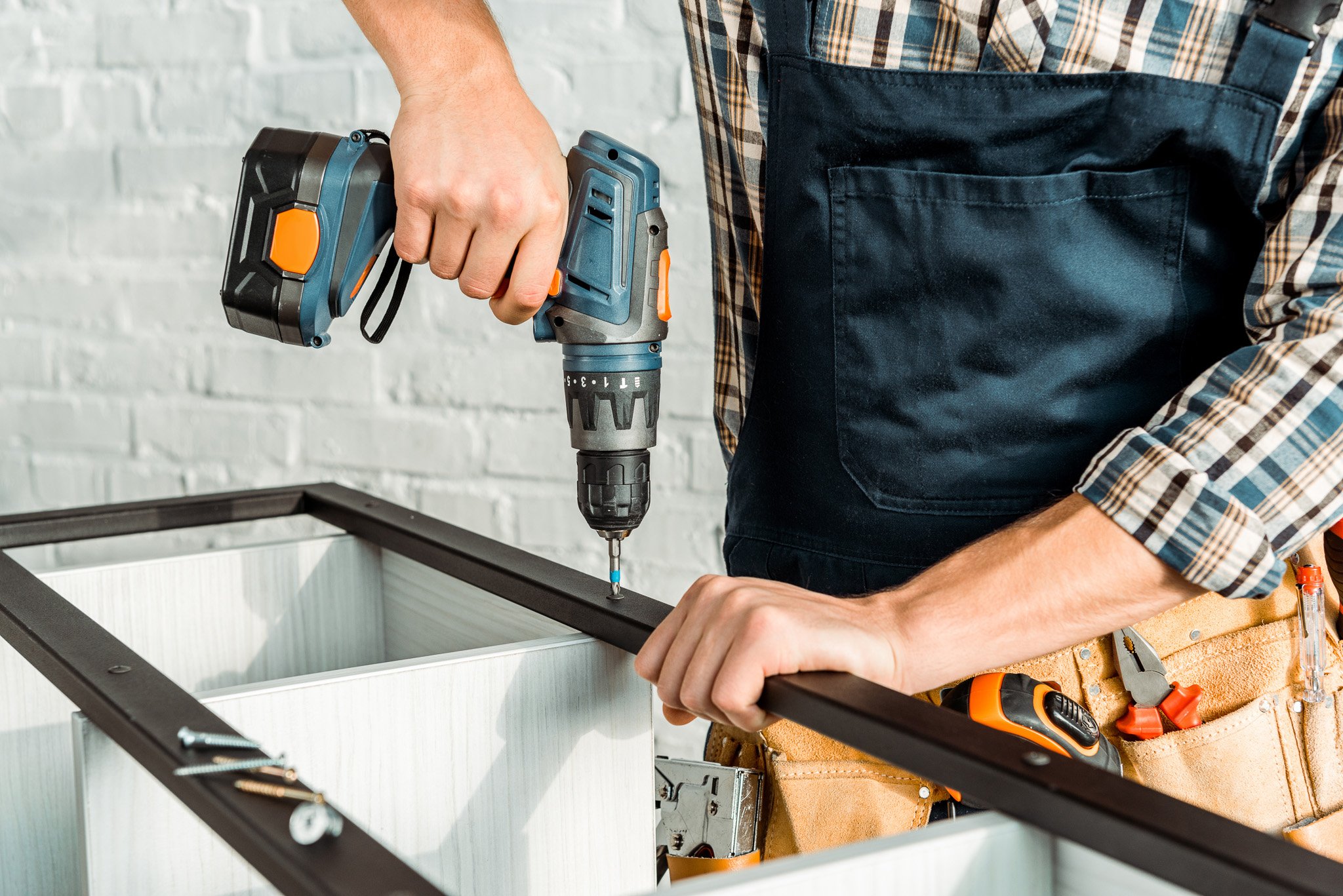 cropped-view-of-installer-holding-hammer-drill-nea-2023-11-27-05-11-09-utc-1